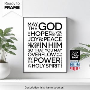 May include: A framed black and white print with the text "May the God of hope fill you with all joy & peace as you trust in him, so that you may overflow with hope by the power of the Holy Spirit." Includes a "Ready to Frame" label.