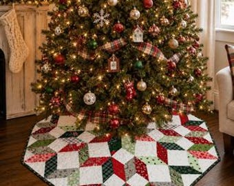 May include: A quilted Christmas tree skirt featuring a geometric star pattern in red, green, white, and grey fabrics. The fabric pieces are arranged in a repeating diamond and star motif with a dark green border trim around the circular edge.