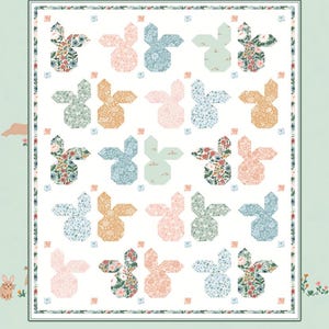 May include: A quilt pattern titled "Sweet Baby Bunny" featuring a repeating pattern of bunny shapes in various colors and floral prints. The design includes pink, blue, and orange bunnies on a white background, with the text "by Coach House Designs".