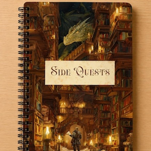 May include: A spiral-bound notebook featuring a fantasy illustration of a library with tall bookshelves, a large green dragon peering from above, and a figure standing in the centre. A rectangular label in the middle displays the text Side Quests.