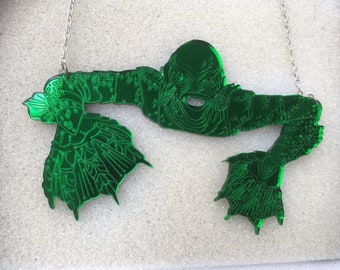 un enorme espejo verde collar llamativo 'CREATURA de la LAGUNA NEGRA'