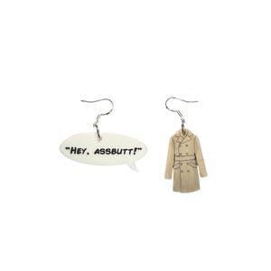 May include: A pair of novelty earrings. One earring is a white speech bubble with the text "HEY, ASSBUTT!". The other earring is a tan trench coat with a double-breasted design and a belt.