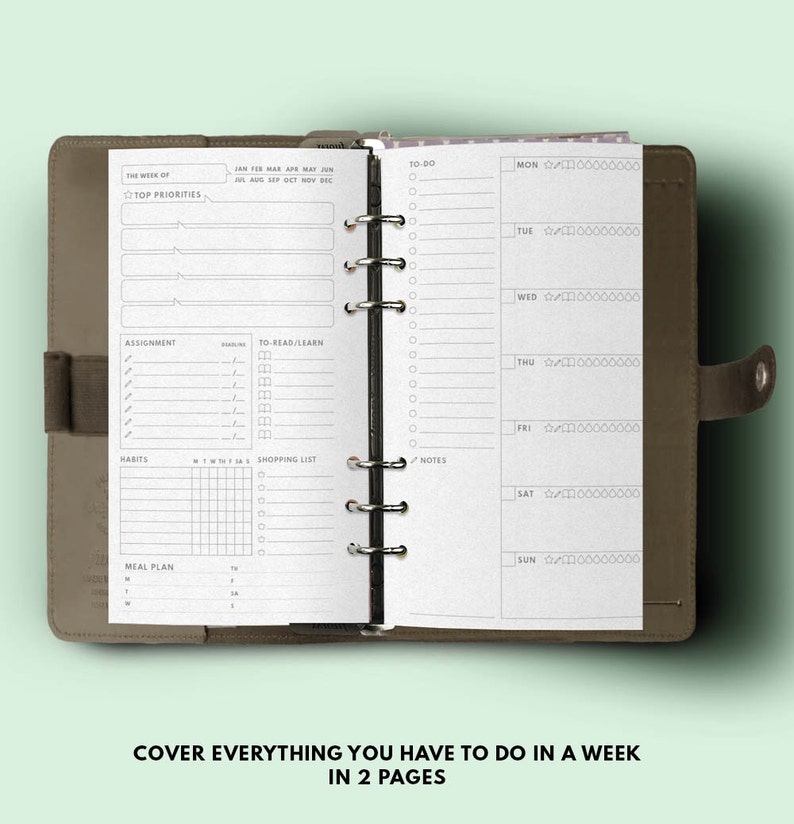 May include: A weekly planner with a brown leather cover. The planner has a black wire-o binding and includes sections for top priorities, assignments, to-read/learn, habits, a shopping list, notes, and a meal plan. The right page has a daily planner with sections for Monday through Sunday.