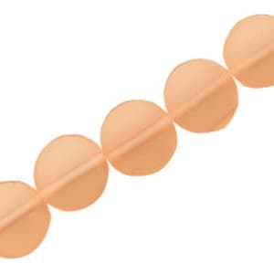 May include: A strand of peach-colored round beads, each bead is flat and has a slight curve.