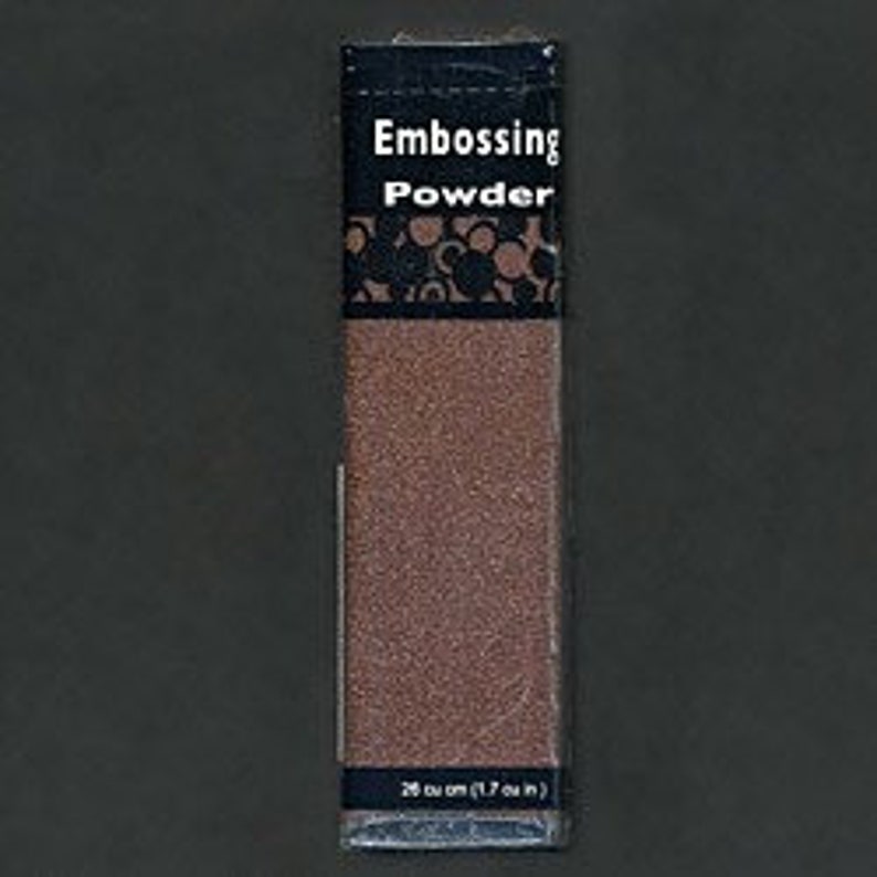 May include: A small package of brown embossing powder. The package is labeled "Embossing Powder" and has a measurement of 28 cu cm (1.7 cu in).