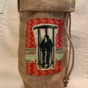 Sac à vin de Noël en toile de jute avec décoration en tissu appliqué