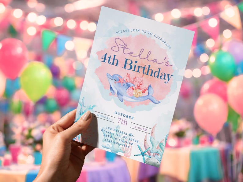 May include: A watercolor-style invitation for a 4th birthday party. The invitation features a blue dolphin with coral accents, the text "Stella's 4th Birthday," and event details. The background is a soft watercolor wash with a pink and blue color scheme.
