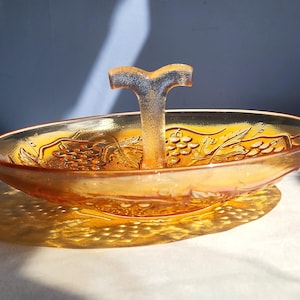 Carnival glass serving bowl fruit tray with center handle Marigold orange color grape design Imperial Glass Ohio 1927 1931 iridescent orange