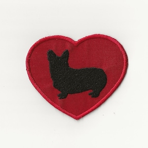 May include: Red felt heart-shaped patch with a black embroidered silhouette of a corgi dog.