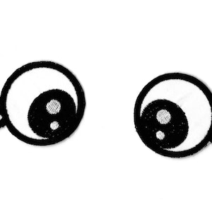 May include: Two black and white cartoon eyes with eyelashes. The eyes are white with black pupils and a white dot in the center of each pupil.