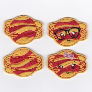 May include: Four embroidered patches featuring a cartoon planet with red and yellow stripes. Two of the patches have a face with eyes, a mouth, and one has glasses and the other has a pink bow.