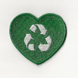 May include: Green heart-shaped patch with a white recycling symbol in the center.