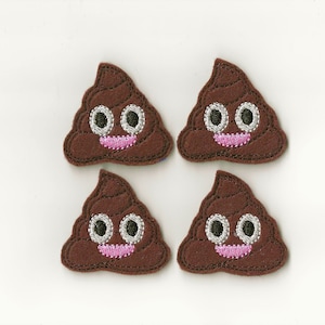 May include: Four brown felt poop emoji patches with white eyes and a pink smiling mouth.