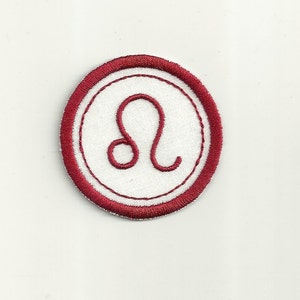 May include: Red embroidered iron-on patch with a white circle and the astrological symbol for Leo.