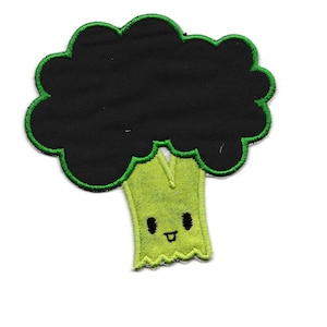May include: Green and black embroidered patch of a cartoon broccoli with a smiling face.