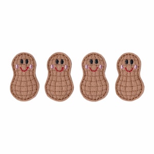 May include: Four brown felt peanut-shaped patches with embroidered smiling faces. Each peanut has a red smile, black eyes, and pink cheeks.
