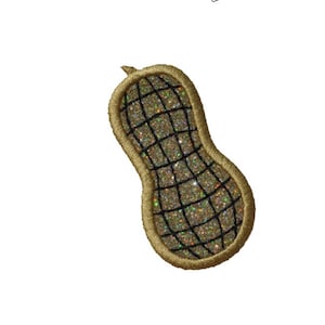 May include: A gold-colored peanut-shaped patch with a black grid pattern and a glittery texture.