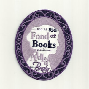 May include: Purple and white embroidered patch with a silhouette of a woman's head in an oval frame. The text reads "She is too fond of books and it has added to her brain."