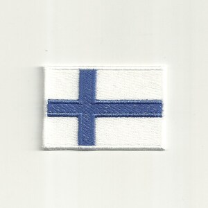 May include: Embroidered patch depicting the Finnish flag. The design features a white background with a blue Nordic cross. The patch is rectangular and has a white border.