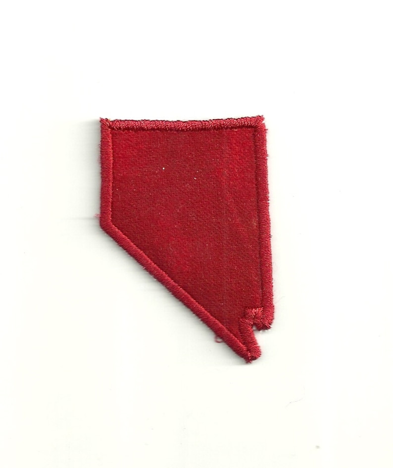 May include: Red felt outline of the state of Nevada.