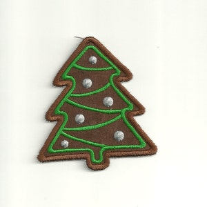 May include: A brown felt Christmas tree with green trim and silver ornaments.