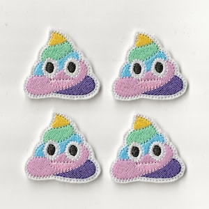 May include: Four embroidered patches shaped like a smiling poop emoji with rainbow colours. Each patch features a yellow, green, blue, and purple design with black eyes and a white border.