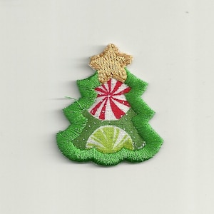 May include: A green felt Christmas tree with a gold star on top. The tree is decorated with red and white candy cane and green and white ornaments.