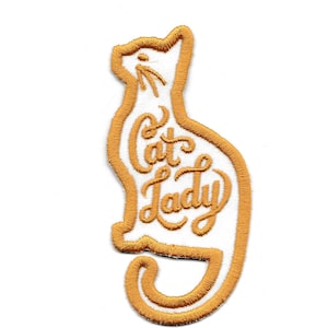 May include: Gold embroidered iron-on patch with a cat silhouette and the text "Cat Lady" inside the silhouette.