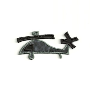 May include: A black and gray embroidered patch of a helicopter. The helicopter has a black rotor and tail.