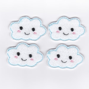 May include: Four white felt cloud appliques with blue stitching around the edges. Each cloud has a smiling face with black eyes and a pink blush on the cheeks.