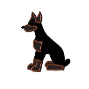 May include: Black and brown embroidered patch of a sitting dog.
