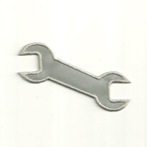 May include: A silver wrench with a white outline. The wrench is a common tool used for tightening and loosening nuts and bolts.