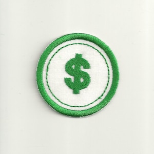 May include: A circular patch featuring a green dollar sign ($) embroidered on a white background. The patch is bordered by a green stitched outline. The design is simple and bold, suitable for various applications.