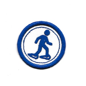 May include: Blue and white embroidered patch with a person ice skating. The patch is circular with a white background and a blue border.