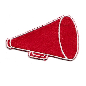 May include: Red felt megaphone with a white outline. The megaphone is a common cheerleading prop.