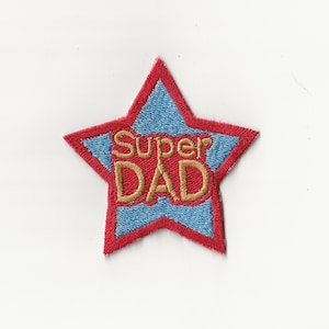 May include: Red star-shaped embroidered patch with blue center and gold lettering that reads "Super Dad".