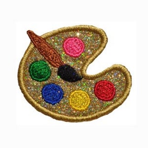 May include: A gold glitter paint palette with a brown paintbrush and colourful paint dots.