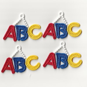 May include: Four sets of embroidered ABC letters, each set is red, blue, and yellow, and each set is hanging from a white chain.