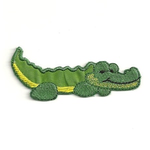 May include: Green embroidered alligator patch with a yellow stripe down the back.