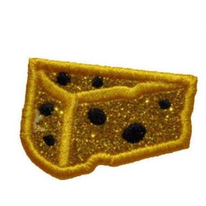 May include: A gold-colored, glittery patch in the shape of a cheese wedge. The patch has a yellow embroidered border and features several black circular holes. The cheese wedge is a fun, whimsical design.