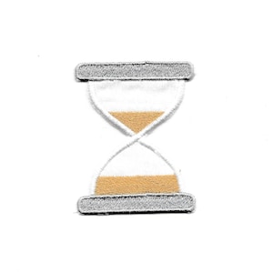 May include: White and gold embroidered hourglass patch with a gray border.