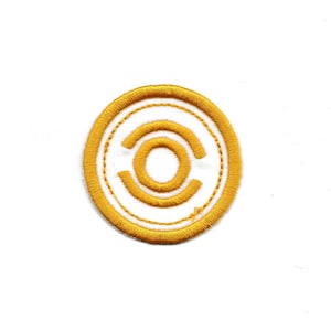 May include: A gold embroidered patch with a stylized letter "C" inside a circle.