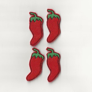May include: Four red felt chili pepper patches with green felt stems and leaves.