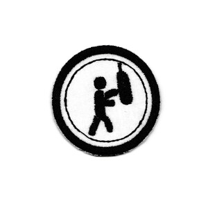 May include: Black and white embroidered patch of a stick figure punching a punching bag inside a black circle with a white outline.