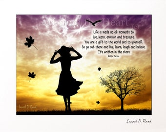 May include: Silhouette of a person in a dress and hat standing in a field with a tree and falling leaves. The sky is a vibrant orange and yellow with a quote by Mother Teresa: "Life is made up of moments to live, learn, envision and treasure. You are a gift to the world and to yourself. So go out there and live, learn, laugh and believe. It's written in the stars."