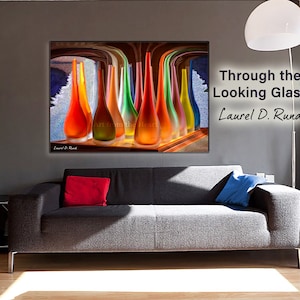 May include: A colorful abstract art print featuring a collection of glass vases in various shades of red, orange, yellow, green, and blue. The vases are arranged in a row on a wooden surface, with a blurred background of a room with a window. The text "Art from the Heart" is visible in the lower center of the image.