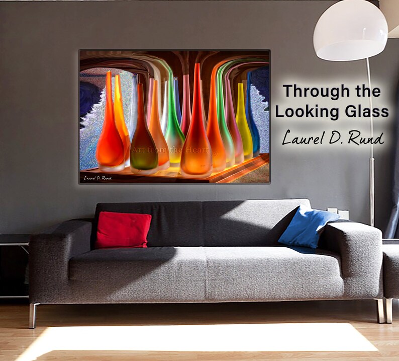 May include: A colorful abstract art print featuring a collection of glass vases in various shades of red, orange, yellow, green, and blue. The vases are arranged in a row on a wooden surface, with a blurred background of a room with a window. The text "Art from the Heart" is visible in the lower center of the image.