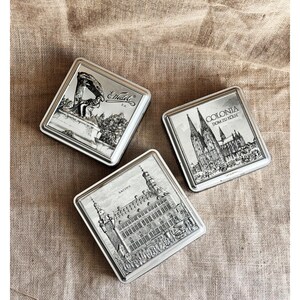 Vintage tysk plåtburk: 3D Aachen-arkitektur, silverpralinrelief