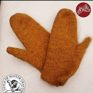 May include: A pair of brown knitted mittens. The mittens are made of a thick, textured yarn and have a simple, classic design.