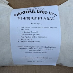 May include: A tie-dye kit in a bag from Grateful Dyes, Inc. The kit includes four colors: fuchsia, lemon yellow, turquoise, and ultra violet, plus dye fixer, pipettes, rubber bands, and instructions. The kit is designed for use on cotton, rayon, bamboo, and other plant-based fabrics.
